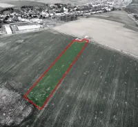 Aerial view of agricultural and forest land in Podhorany, highlighted plot.