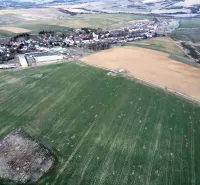 Agricultural and forest lands near Podhorany, capturing the landscape scenery and surrounding fields.