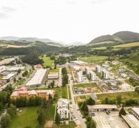 Aerial view of Brezno, Barracks Quarter, surrounded by greenery and residential buildings, suitable for Plots - housing.