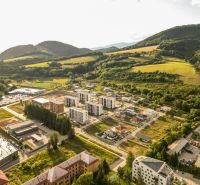 A view of the Barracks District in Brezno - Residential plots in a mountainous environment.