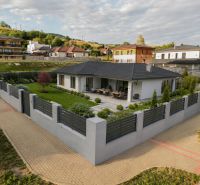 A house with a garden on a plot in Brezno, Štvrť kasárne, surrounded by a fence. Land - residential.