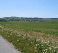 Panoramic view of unique properties in picturesque Jarovnice surrounded by green fields.