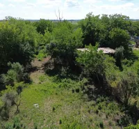 Greenery and buildings on the property in Hronovce designated for living.