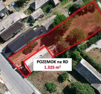 Aerial view of a residential plot in Hrnčiarska Ves, fenced, with surrounding houses.