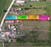 Residential plots in Rakytník divided into sections, surrounded by greenery.