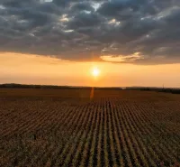 Sunset over the fields in Lekárovce, agricultural and forest lands, dramatic clouds.