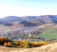 A view of agricultural and forest lands around Rejdová, surrounded by autumn landscape.