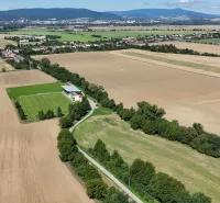 Aerial view of agricultural and forest land around Nová Ves nad Váhom.