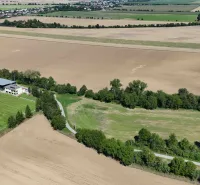 Agricultural and forest lands in Nová Ves nad Váhom include a playground and the surrounding landscape.