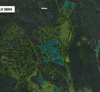 Aerial view of agricultural and forest lands around Brusno.