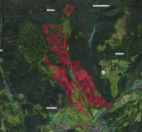 An aerial map with color-coded agricultural and forest lands around Brusno.