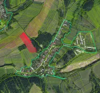 Aerial map of agricultural and forest lands around the village of Dúbravica, showing economic areas.