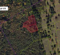 Aerial view of agricultural and forest land near Lúčky with marked parcels.
