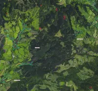 Aerial view of agricultural and forest lands around Poniky.