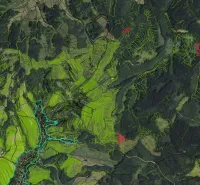 Satellite view of agricultural and forest lands around the village of Poniky.