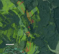 Aerial view of agricultural and forest lands around Petrova Lehota.