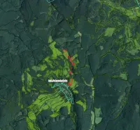 Aerial view of agricultural and forest lands around Petrova Lehota.
