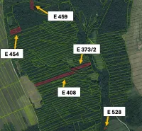 Aerial view of agricultural and forest lands around Hankovce with plotted parcels.