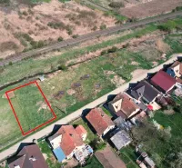 Plots - housing in Hodejov with a view of the railway track and neighboring houses.