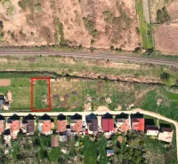 Plots - housing in Hodejov near the railway track with village houses and green area.