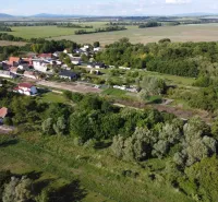 Aerial view of the Gardens in Branč, surrounded by greenery and fields.