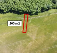 Agricultural and forest land near Kozárovce, area of 203 m² between fields and forest.