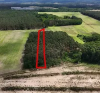 Aerial view of agricultural and forest land in Lozorno, surrounded by forests.