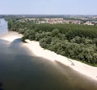 Aerial view of agricultural and forest land near the river in Zemné.