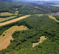 Aerial view of agricultural and forest lands in Žitná - Radiša, with forests and fields.