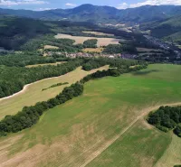 Panorama of agricultural and forest lands in Žitná - Radiša with a view of the mountains.