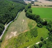 Meadows and forests near Žitná - Radiša, agricultural and forest land, a road running along the forest.