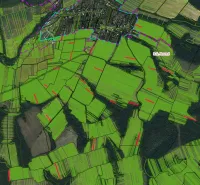 Agricultural and forest lands around Rovné with prominent green plots and forest areas.