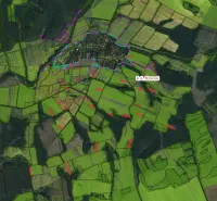 Agricultural and forest lands in Rovné, viewed from a bird's eye perspective.