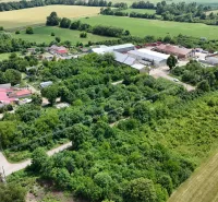 Aerial view of green lands - housing in Parchovany surrounded by fields and greenery.