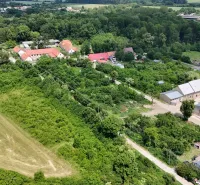 Aerial view of green residential plots in Parchovany with surrounding nature.