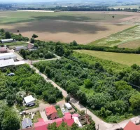 Aerial photograph of residential plots with fields and buildings in Parchovany.