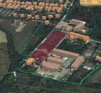 An aerial view of residential plots in Parchovany surrounded by buildings and fields.