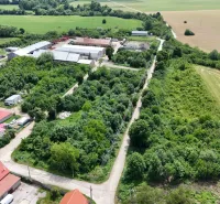 Aerial view of plots in Parchovany, surrounded by greenery and fields.