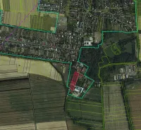 Aerial view of residential plots in Parchovany surrounded by fields and greenery.