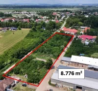 Aerial view of residential plots in Parchovany, surrounded by greenery.