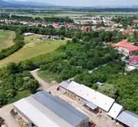 An aerial view of Parchovany shows plots - housing surrounded by greenery and buildings.