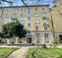 Residential building in Bratislava - Old Town with a green front garden and trees.