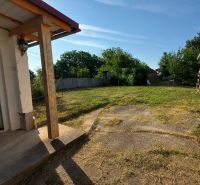 In Veľké Ripňany, there is a garden by a family house with a well-maintained lawn and a gazebo.