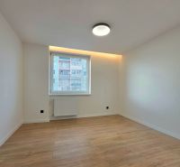 A room in a 3-room apartment with a wooden decor floor.