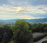 View of greenery and the city from Bielocerkevská Street in Košice.