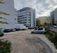 Parking lot with cars between buildings on Stefanicova Street in Bratislava, Old Town.
