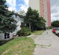 A view of the apartment building on Talichova Street in Bratislava - Dúbravka with a parking lot.