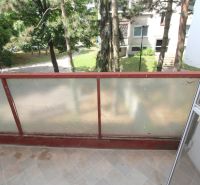 The balcony of a 2-room apartment with a view of greenery on Talichova Street in Bratislava - Dúbravka.