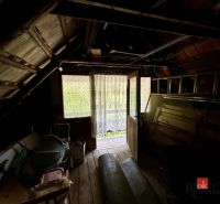 Attic in a family house with wooden decor and natural light.
