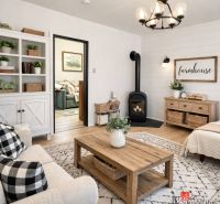Living room in a family house with a fireplace, wooden decor flooring, and white furniture.